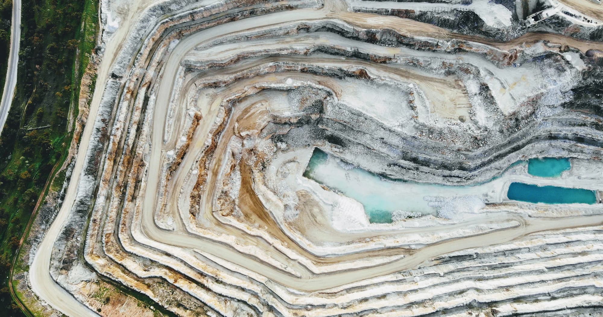 Aerial view of a terraced open-pit quarry
