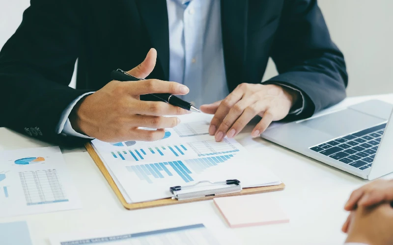 man reading a financial report.webp